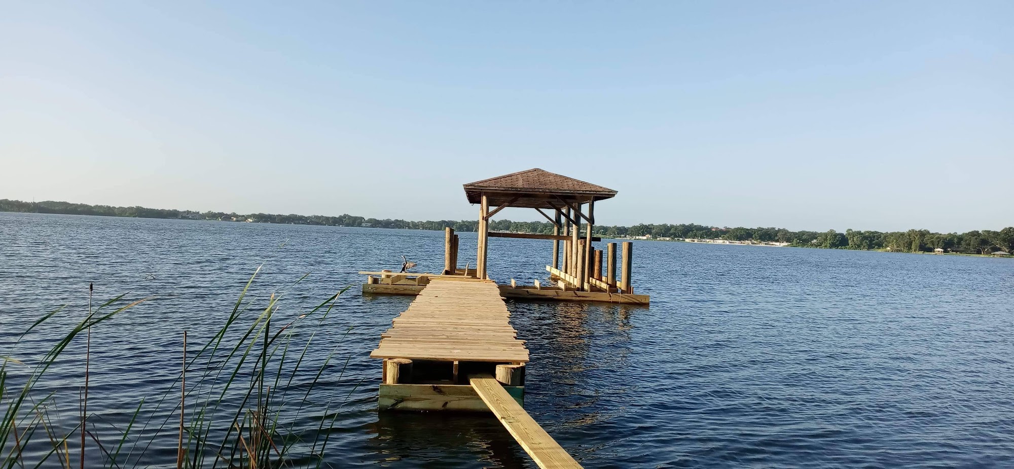Long dock extending toward a covered platform