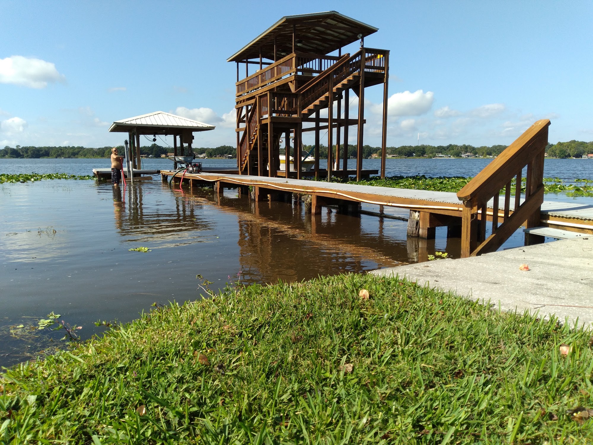 Long wooden walkway leading to a covered dock